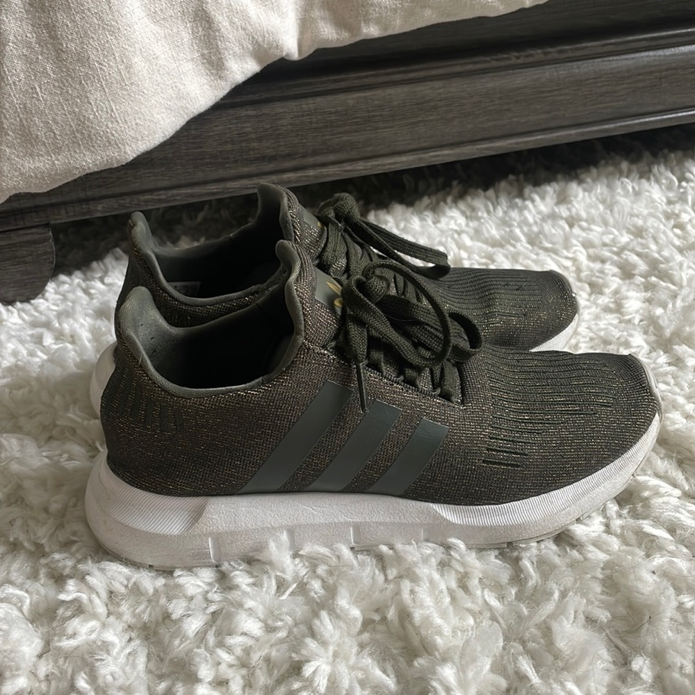 Hunter green and gold Adidas tennis shoes